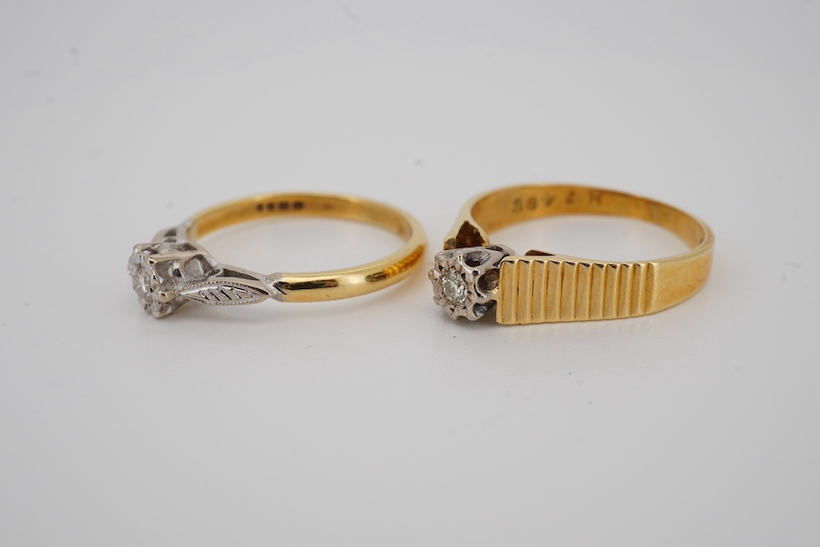 Two modern 18ct gold and illusion set single stone diamond set rings, sizes M and O, gross weight 6.1 grams.